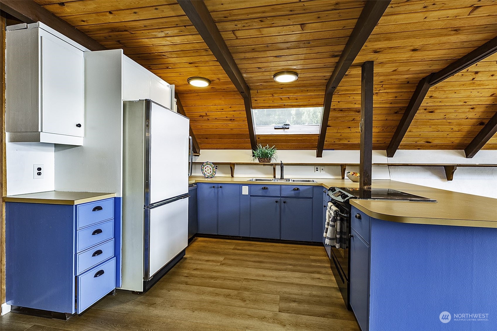 14125 Lyle Point Road Anderson Island, WA 98303 - Photo 14 of 38 a kitchen with a stove and a refrigerator