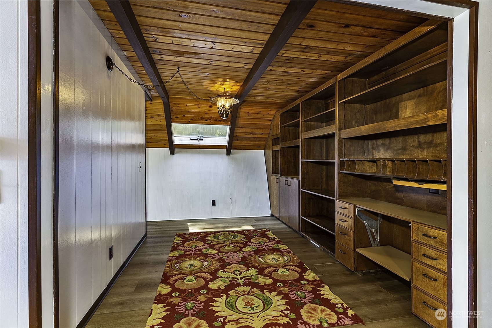14125 Lyle Point Road Anderson Island, WA 98303 - Photo 15 of 38 a view of walk in closet with wooden floor
