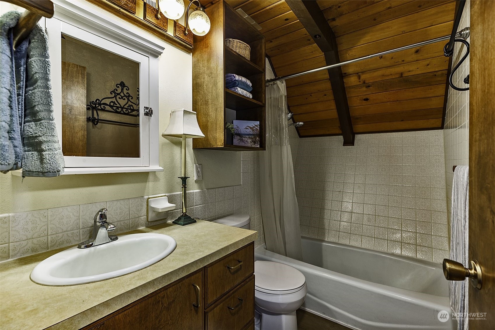 14125 Lyle Point Road Anderson Island, WA 98303 - Photo 18 of 38 a bathroom with a sink toilet and shower