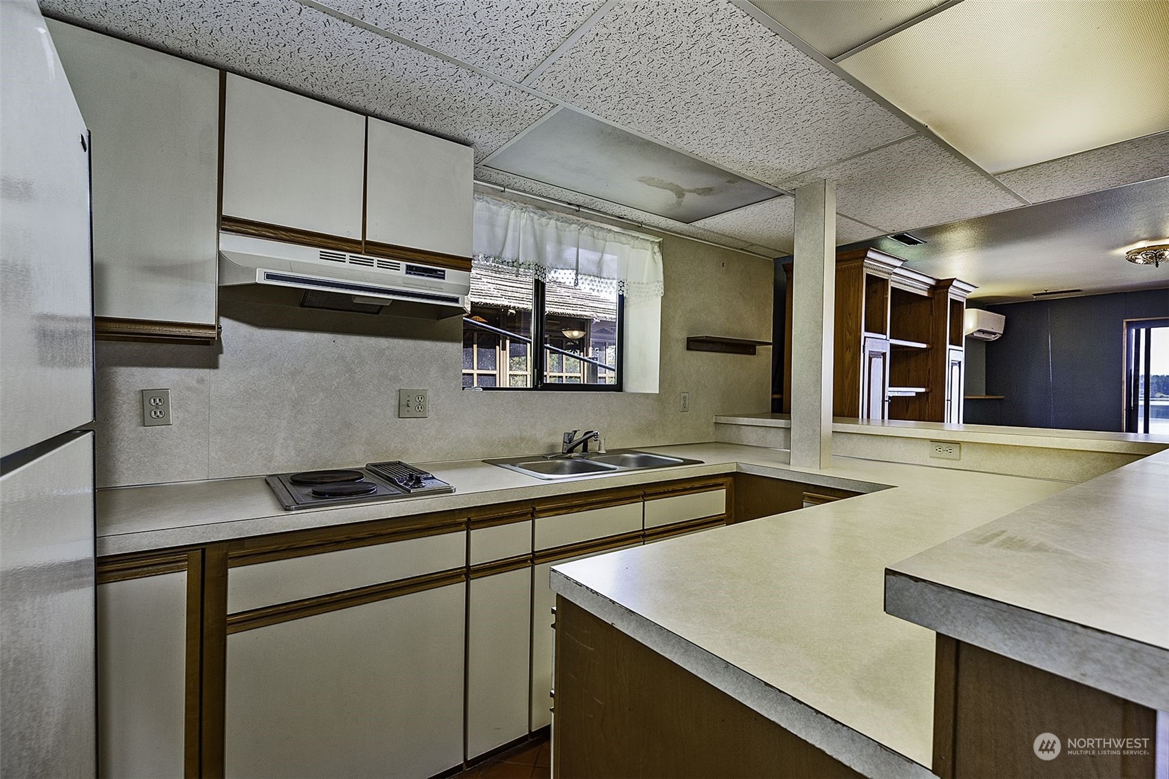 14125 Lyle Point Road Anderson Island, WA 98303 - Photo 24 of 38 a kitchen that has a sink and a stove