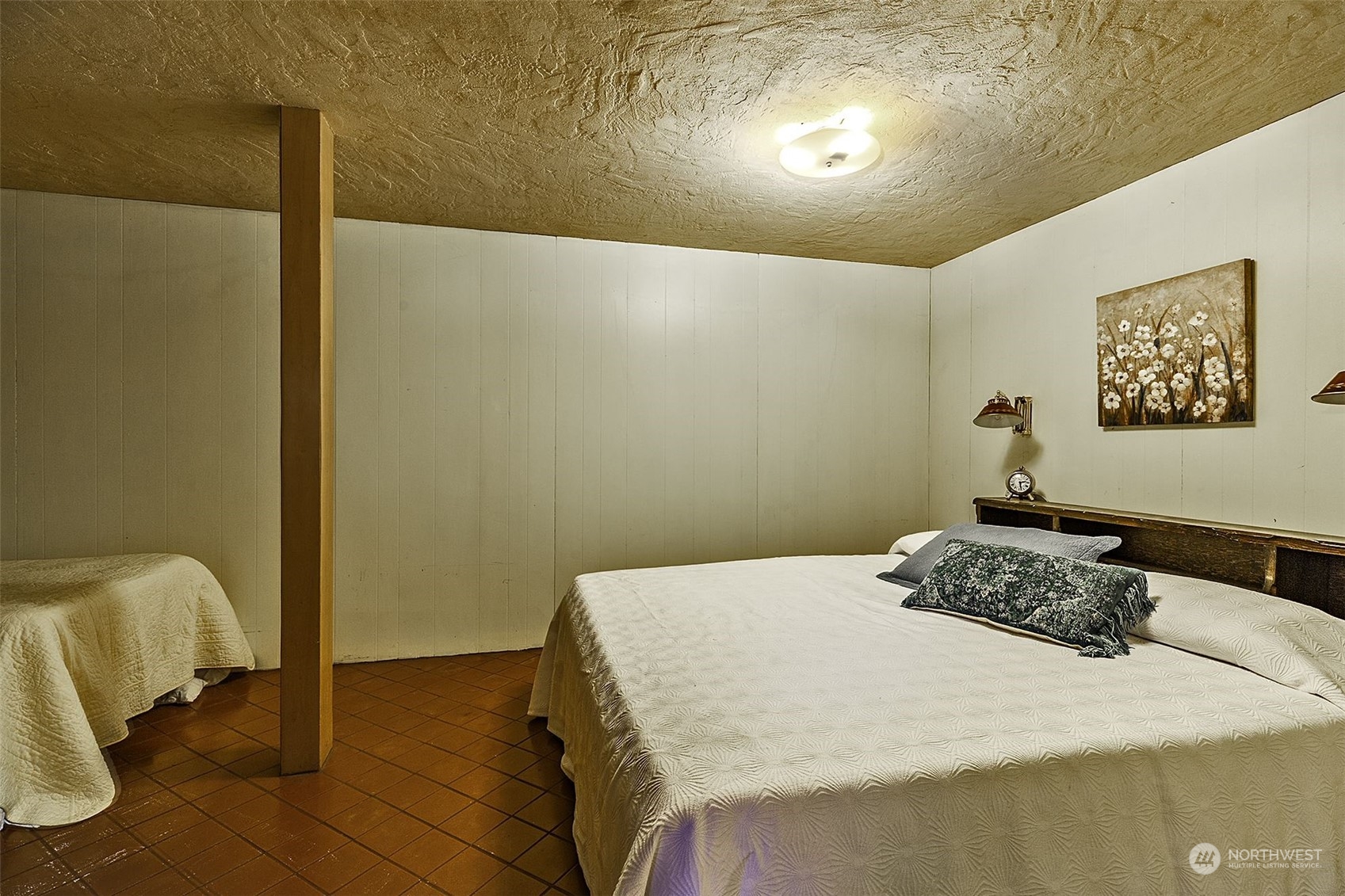 14125 Lyle Point Road Anderson Island, WA 98303 - Photo 25 of 38 a bedroom with a bed and a table in it