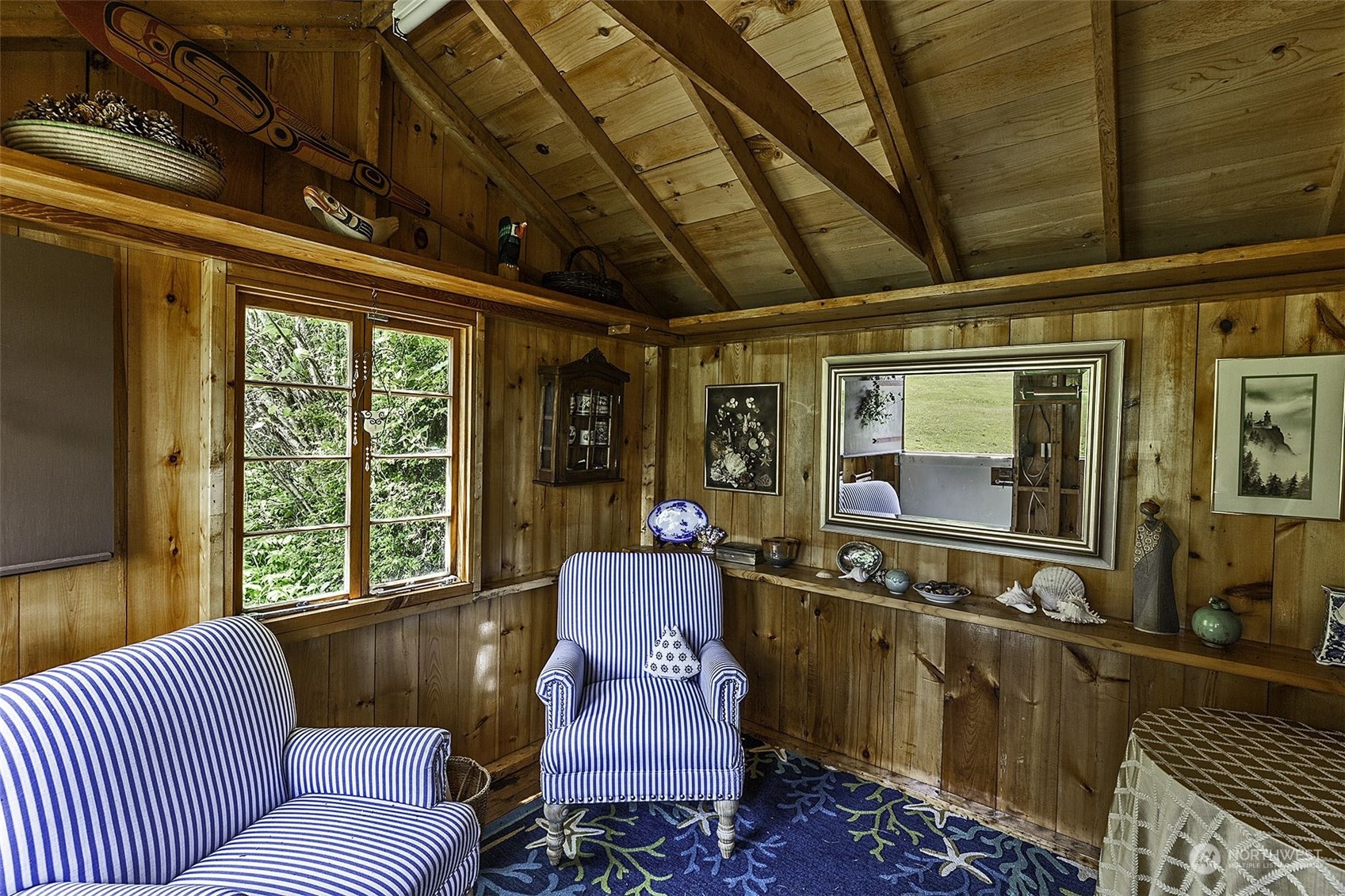 14125 Lyle Point Road Anderson Island, WA 98303 - Photo 32 of 38 a living room with furniture and a large window