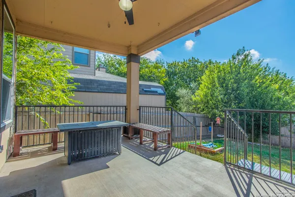 a view of a balcony with chairs