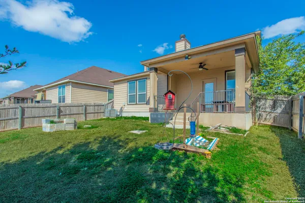 a view of a house with a backyard