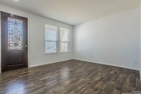 an empty room with windows