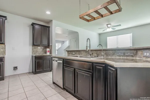 a bathroom with a sink vanity and granite
