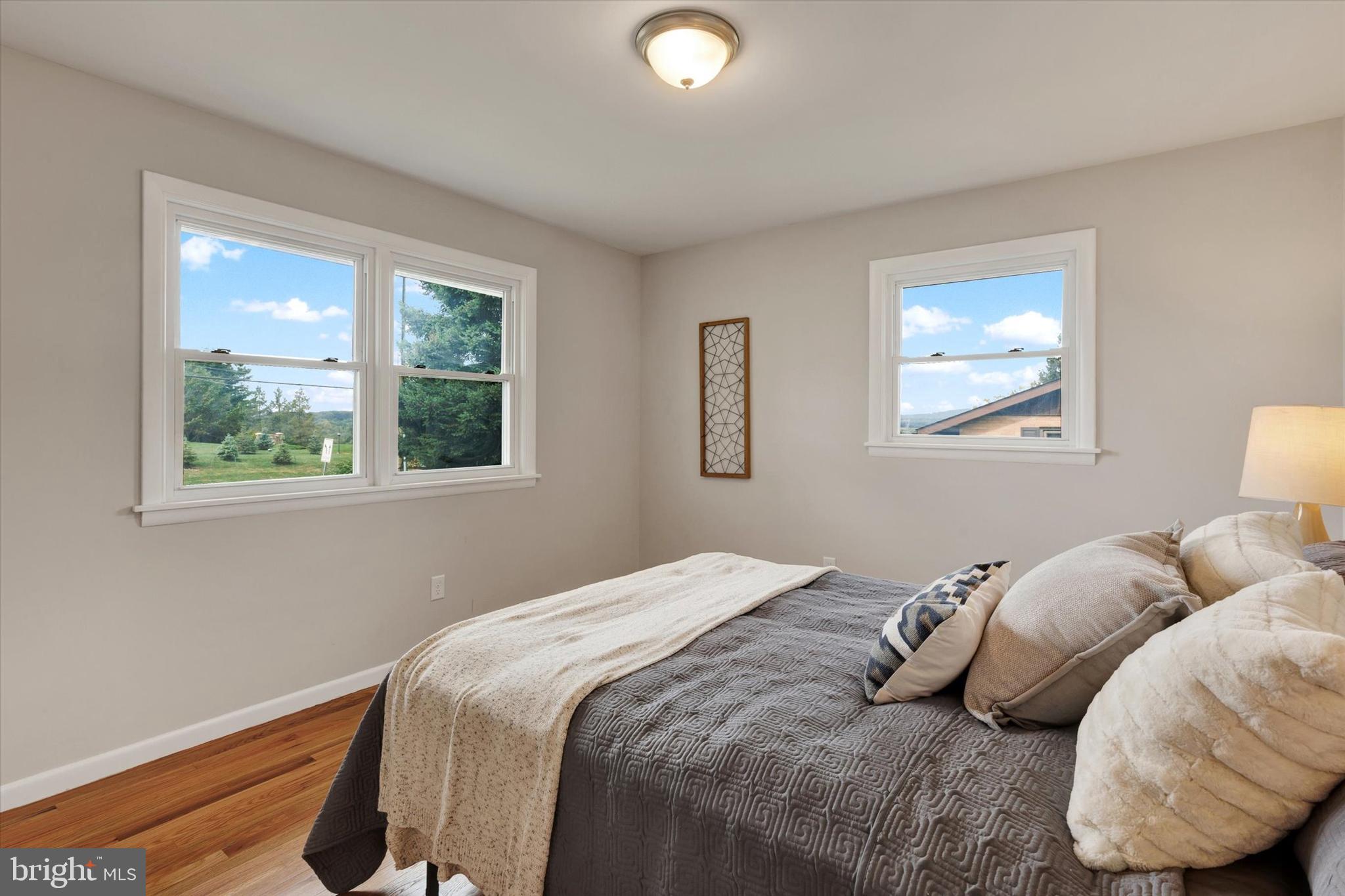 1227 Lebanon Road Manheim, PA 17545 - Photo 14 of 31 a bedroom with a bed and a window