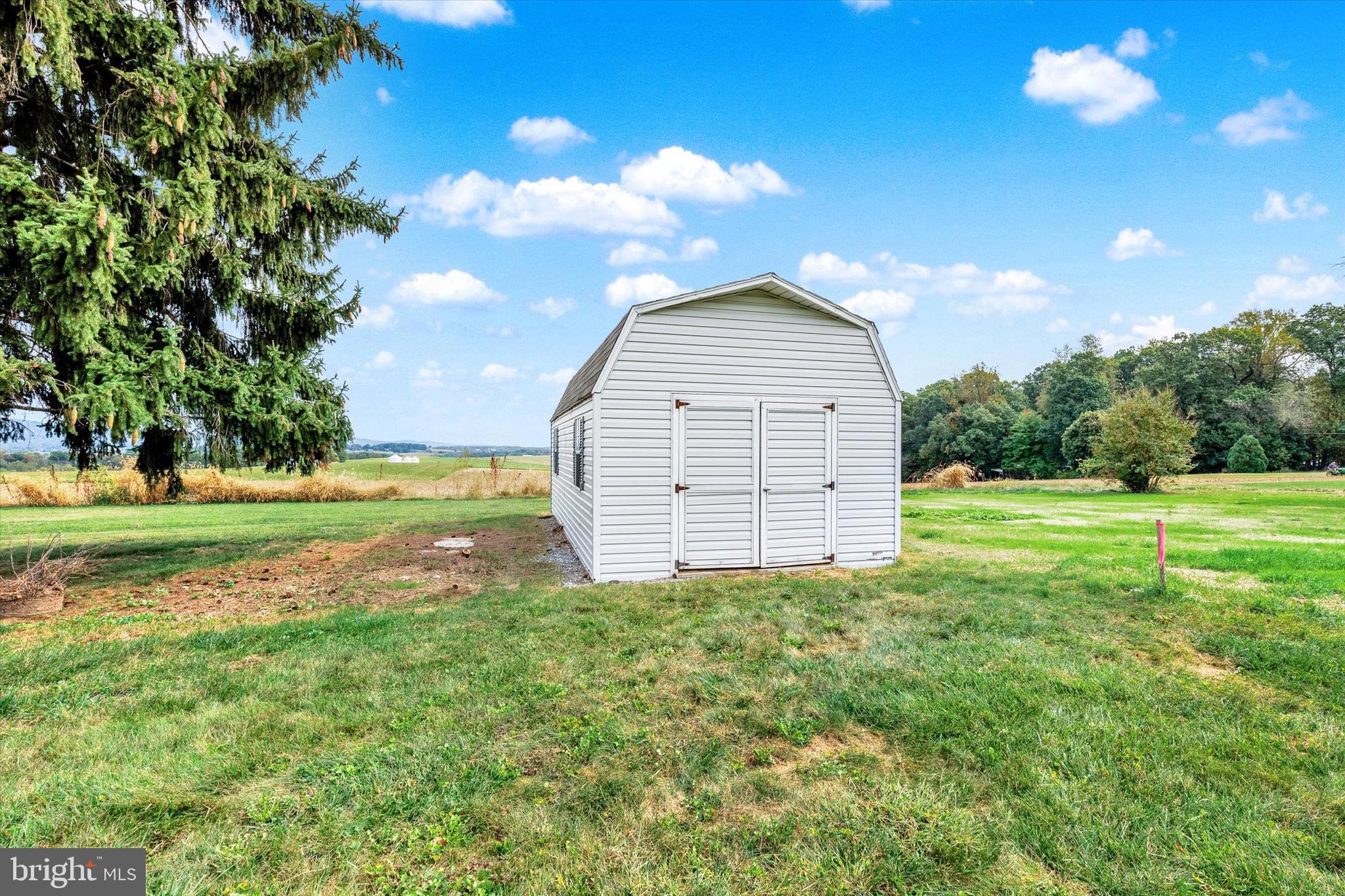 1227 Lebanon Road Manheim, PA 17545 - Photo 27 of 31 a view of a house with a yard