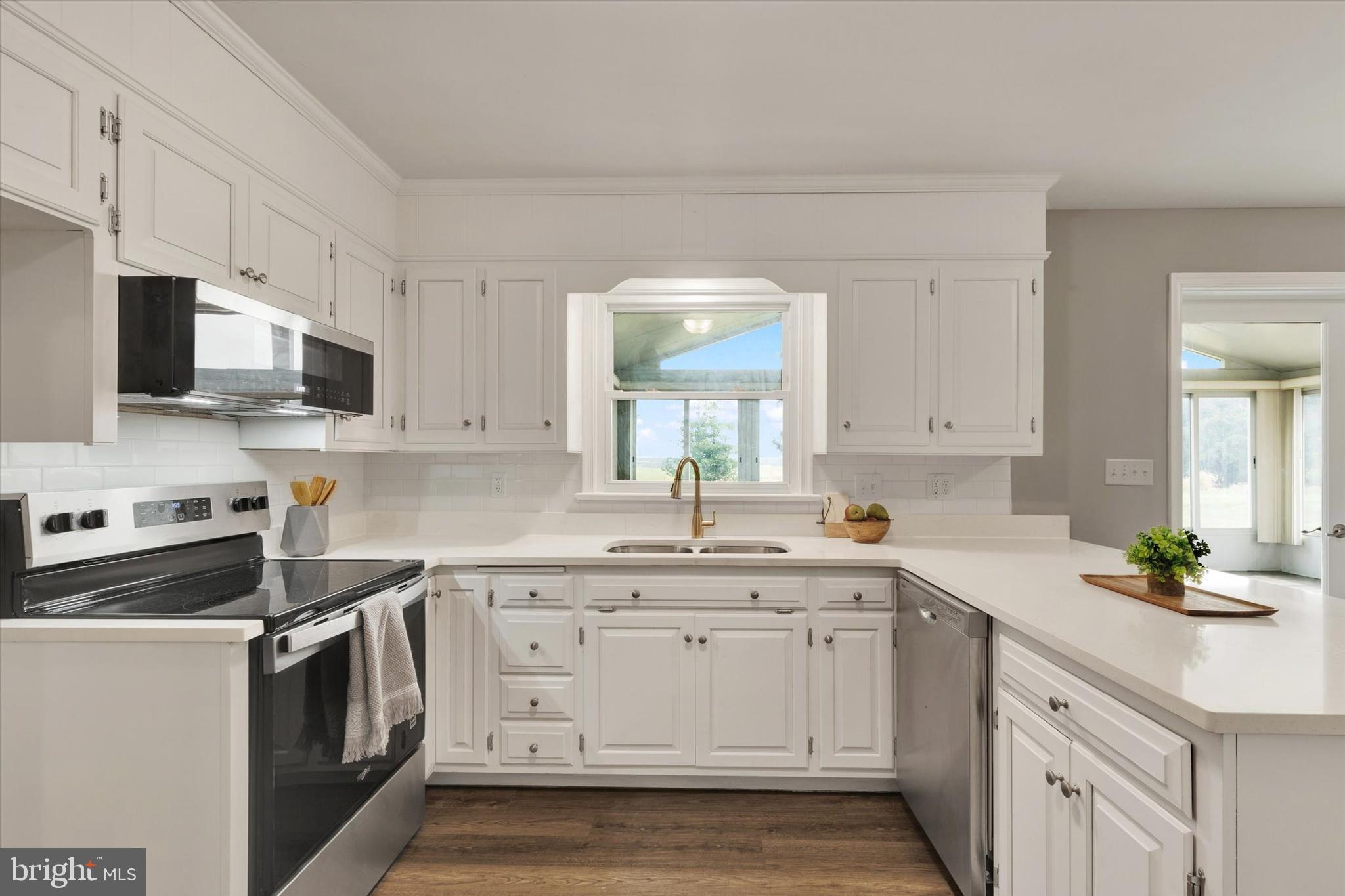 1227 Lebanon Road Manheim, PA 17545 - Photo 3 of 31 a kitchen with white cabinets stainless steel appliances and sink