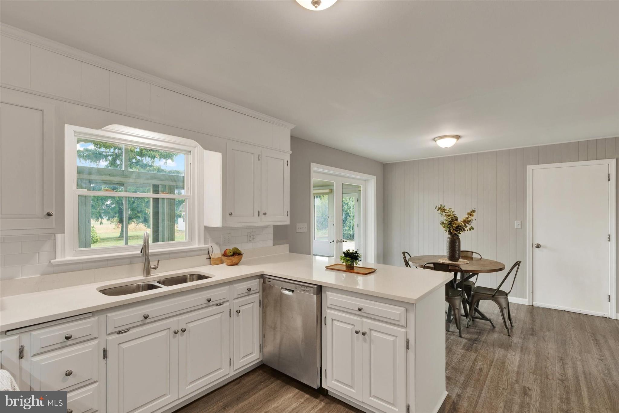 1227 Lebanon Road Manheim, PA 17545 - Photo 4 of 31 a kitchen with a sink white cabinets and white appliances