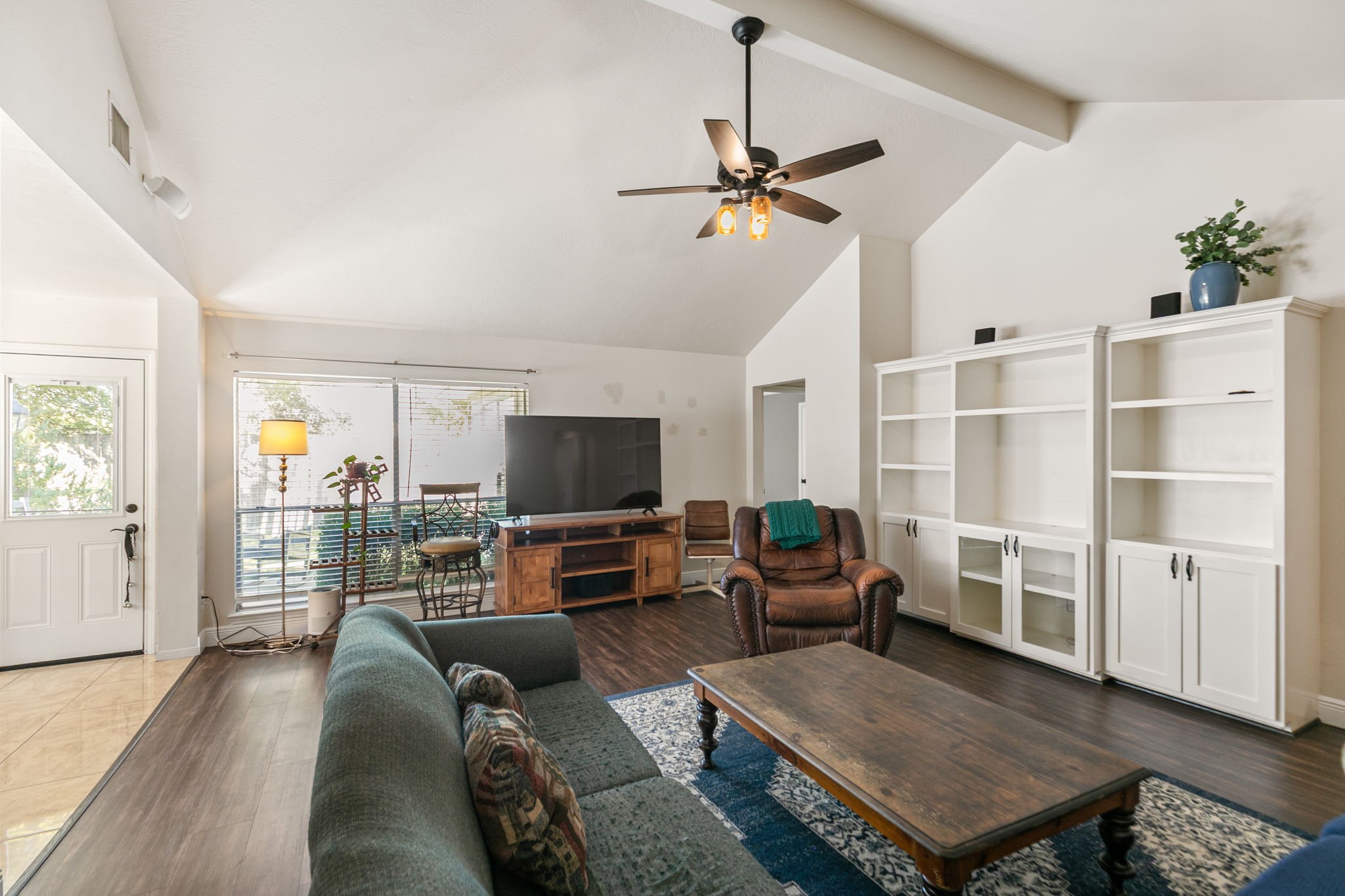 3714 Colleen Woods Circle Houston, TX 77080 - Photo 11 of 29 a living room with furniture and a flat screen tv