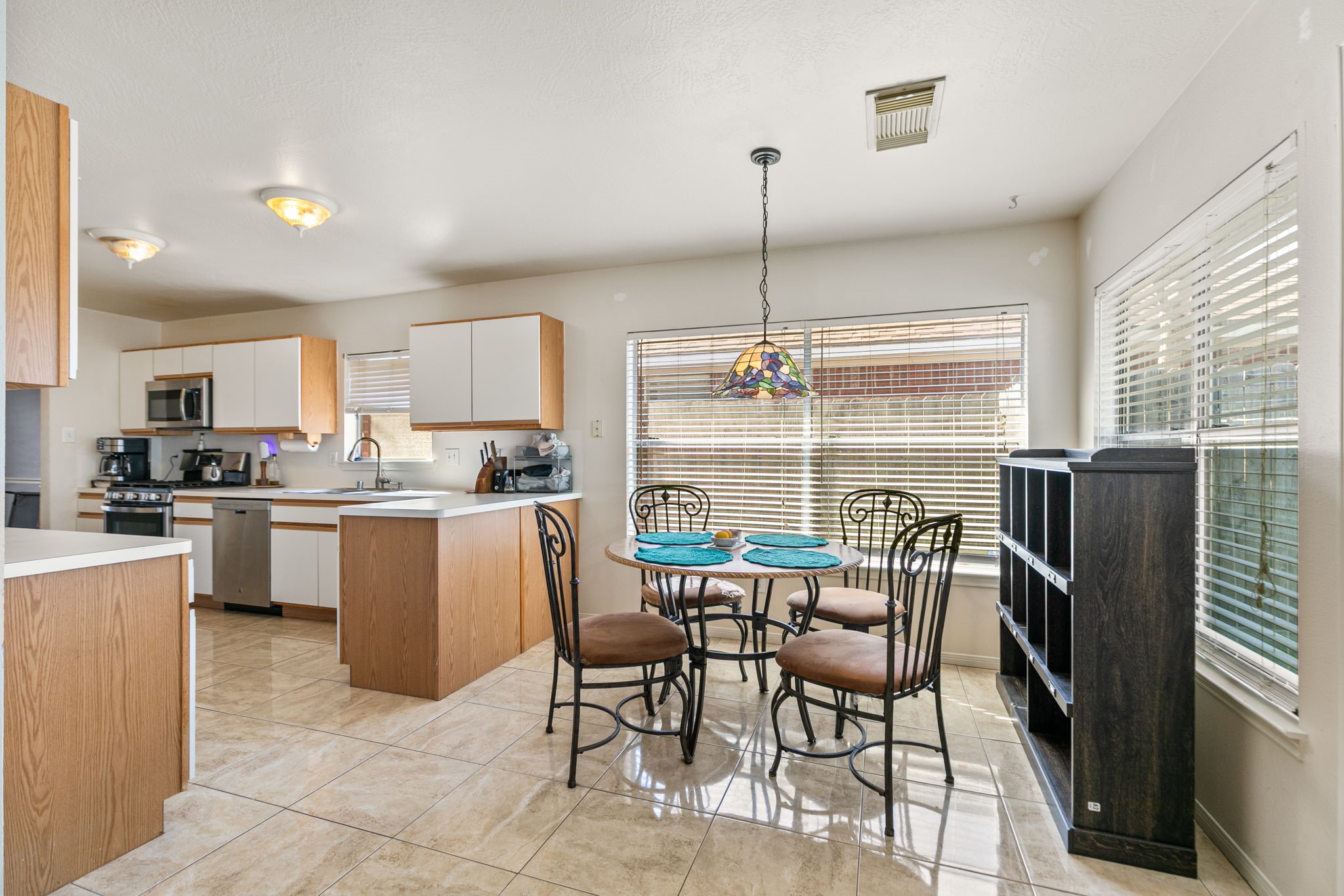 3714 Colleen Woods Circle Houston, TX 77080 - Photo 13 of 29 a kitchen with kitchen island a refrigerator and microwave