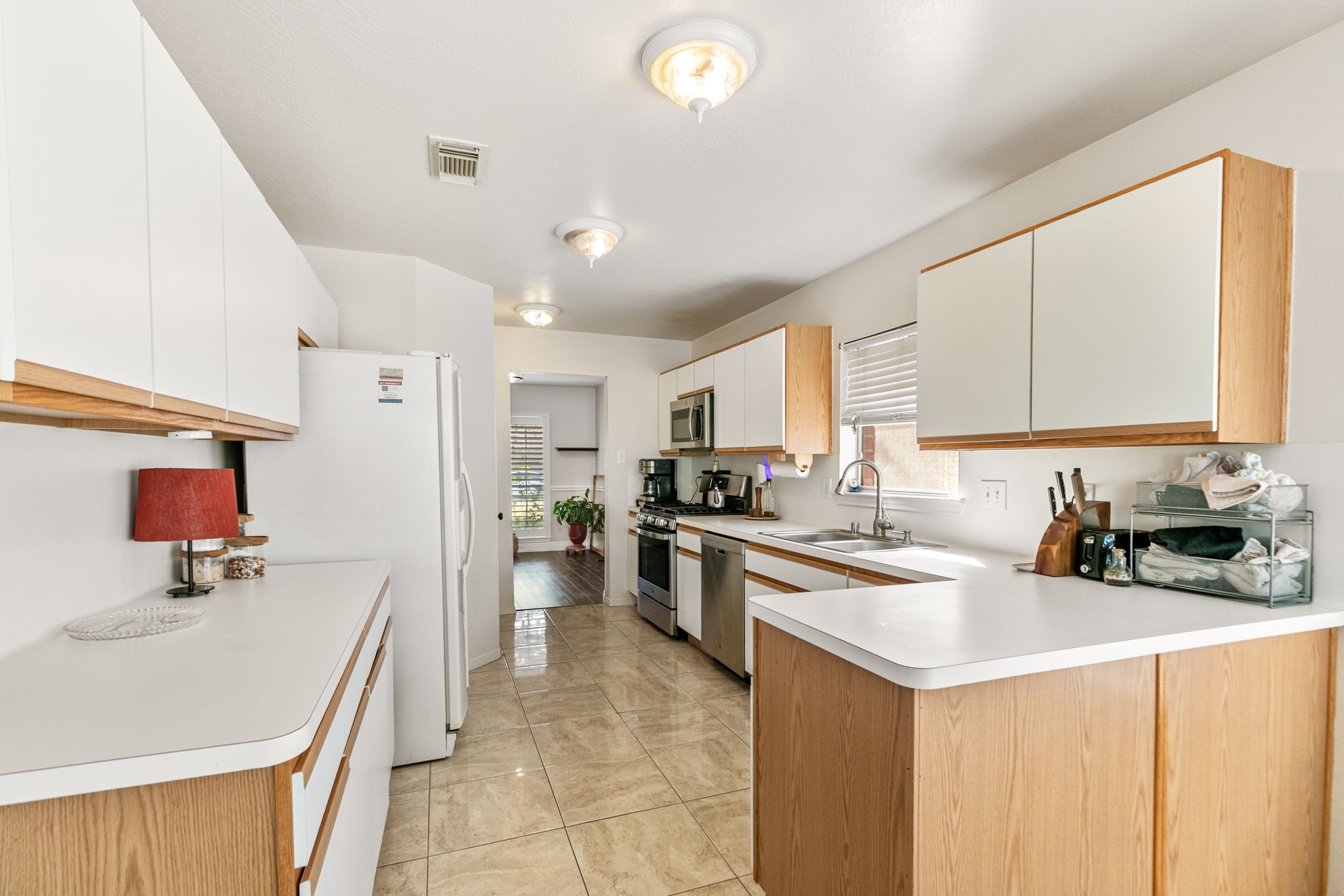 3714 Colleen Woods Circle Houston, TX 77080 - Photo 14 of 29 a kitchen with a sink a stove top oven and cabinets