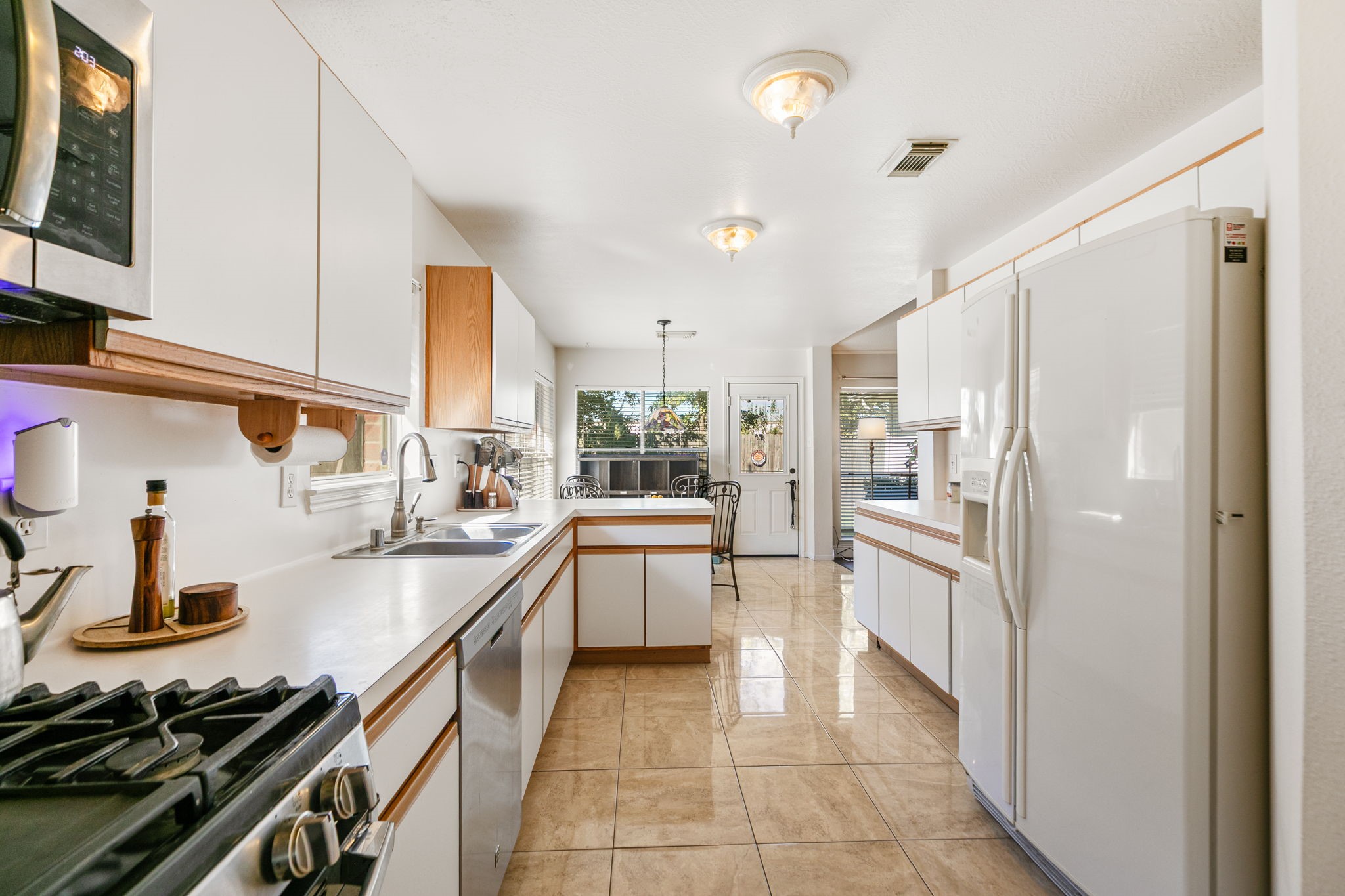 3714 Colleen Woods Circle Houston, TX 77080 - Photo 17 of 29 a kitchen with stainless steel appliances a sink stove and refrigerator