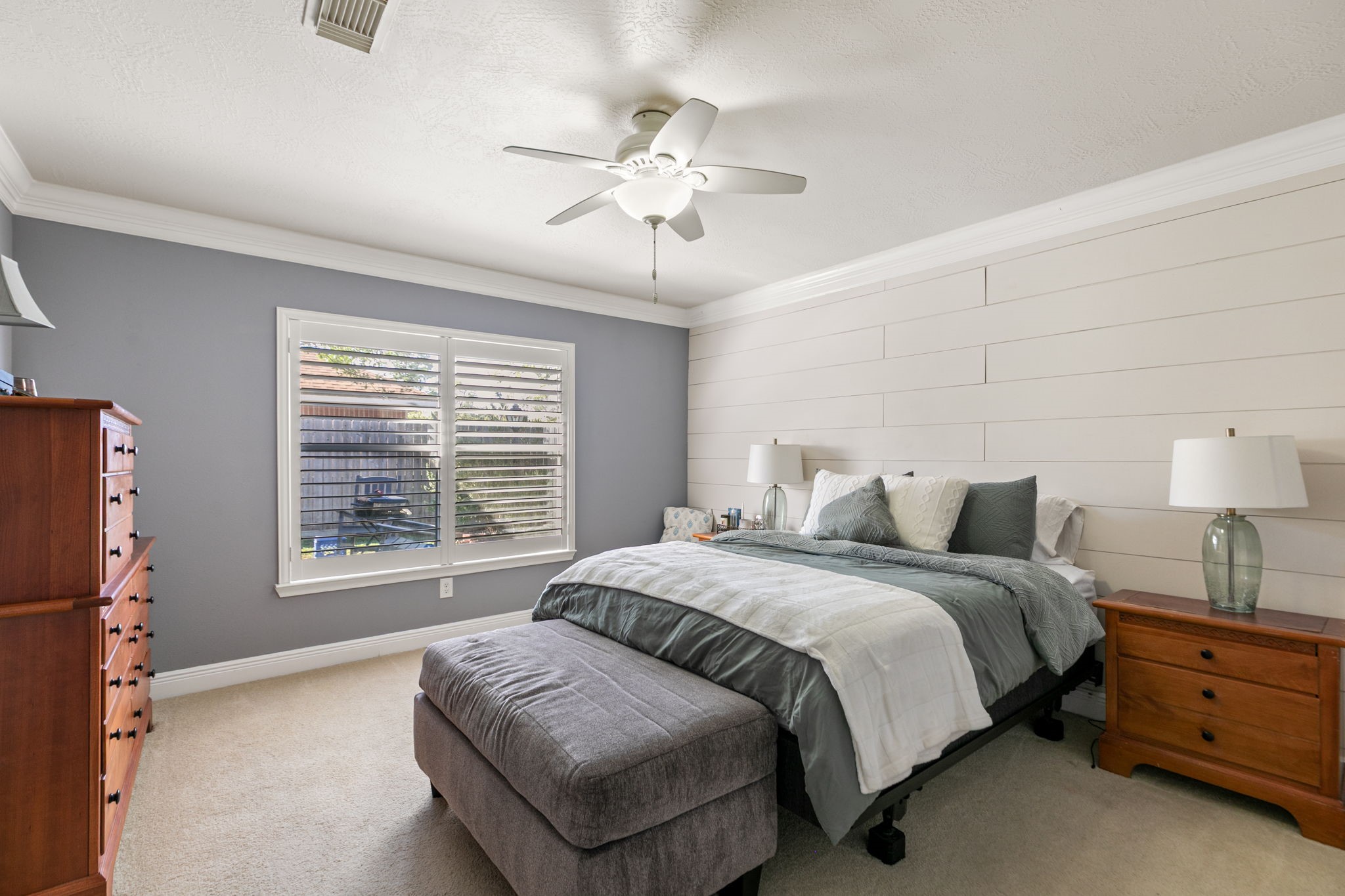 3714 Colleen Woods Circle Houston, TX 77080 - Photo 18 of 29 a spacious bedroom with a bed and a chandelier