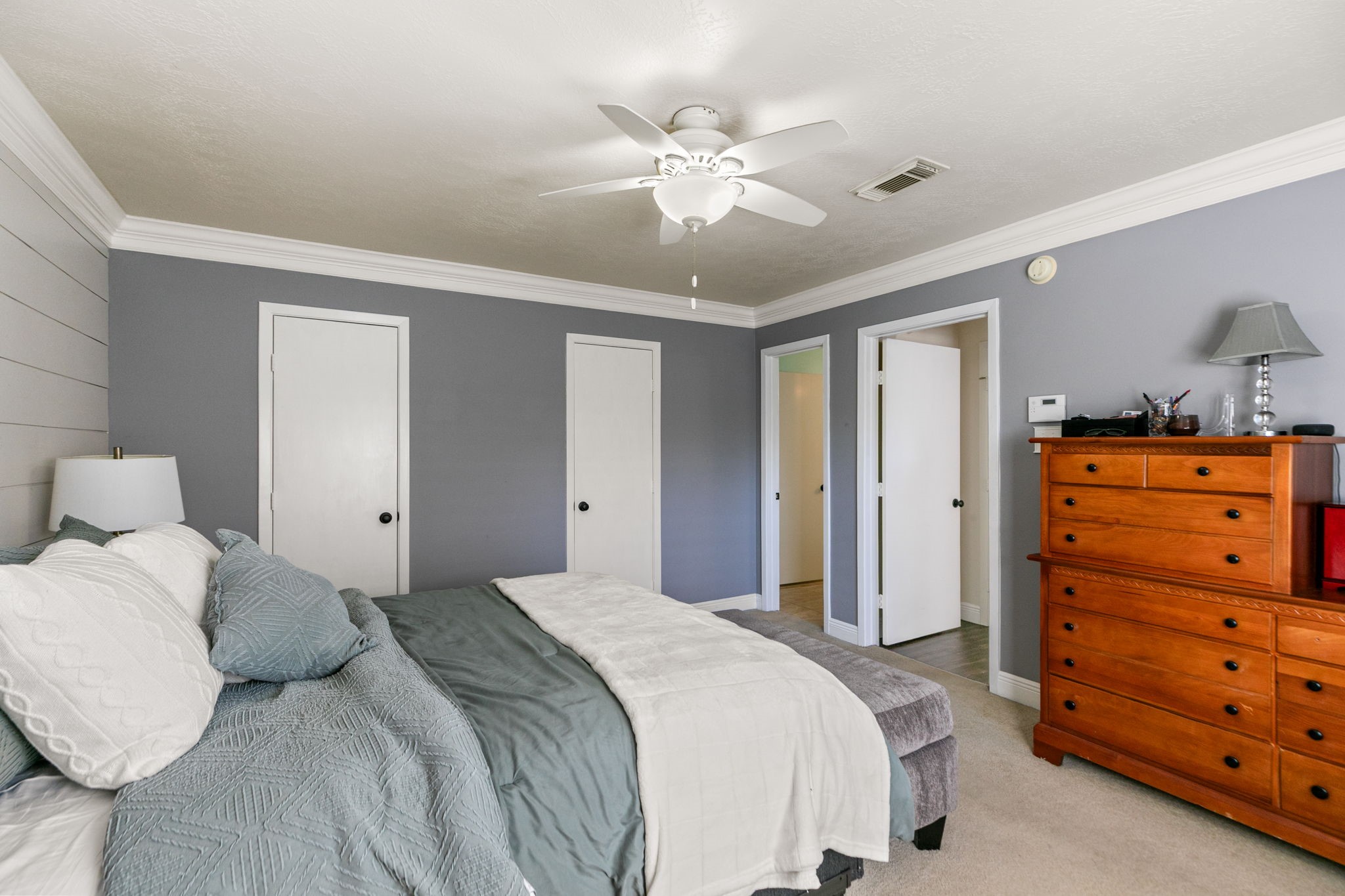 3714 Colleen Woods Circle Houston, TX 77080 - Photo 20 of 29 a bedroom with a bed and a dresser