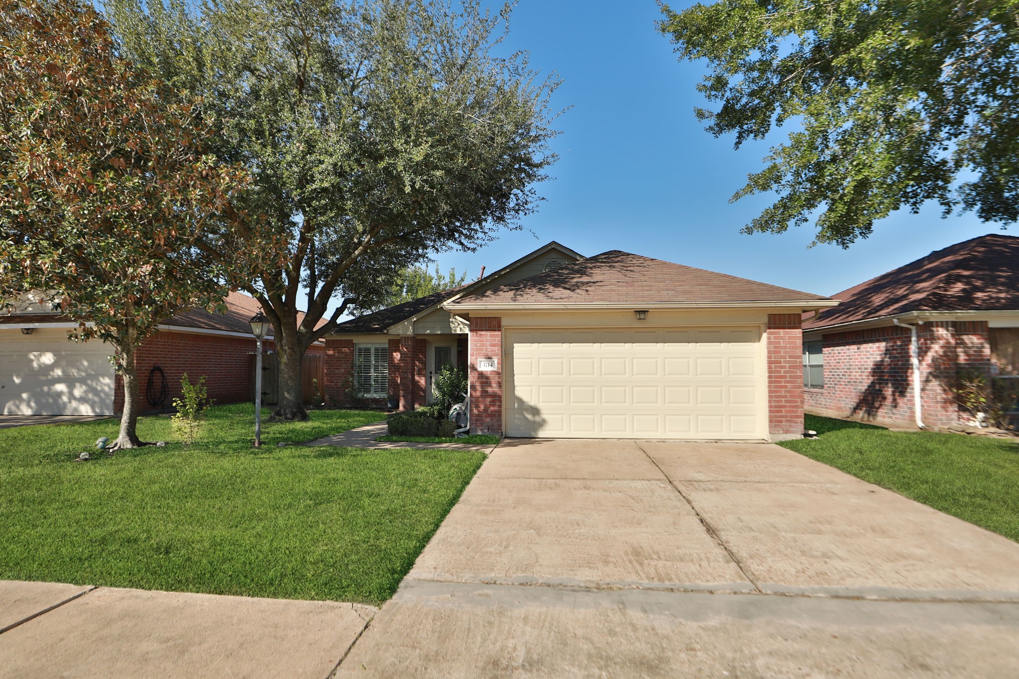 3714 Colleen Woods Circle Houston, TX 77080 - Photo 3 of 29 a front view of a house with a yard and garage