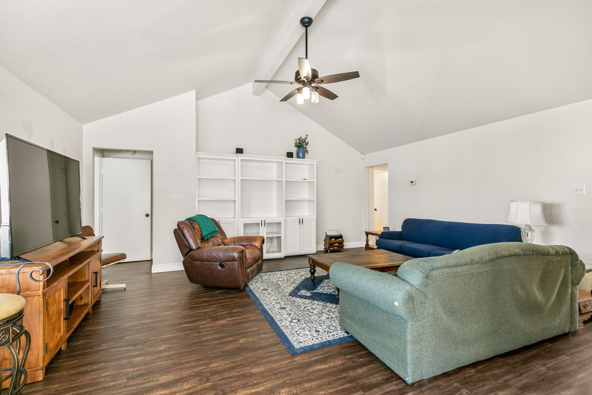3714 Colleen Woods Circle Houston, TX 77080 - Photo 10 of 29 a living room with furniture and a flat screen tv