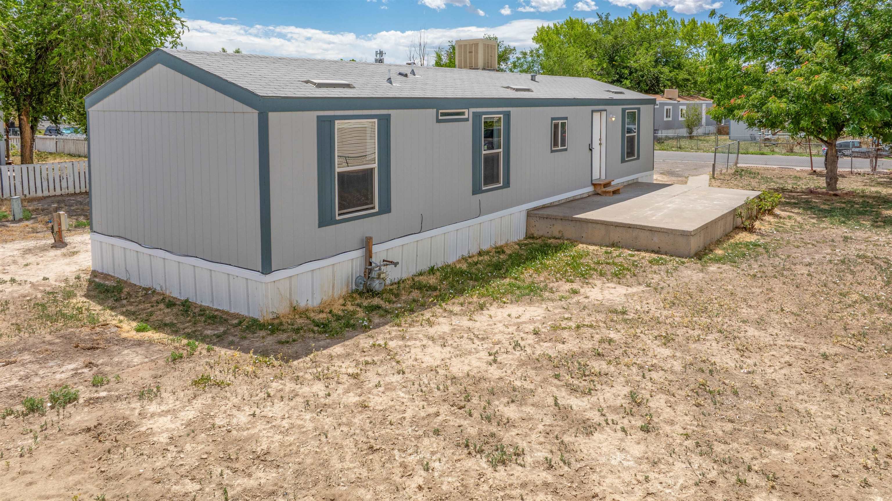 424 32 Road, Unit 85 Clifton, CO 81520 - Photo 12 of 12 a view of a house with a yard