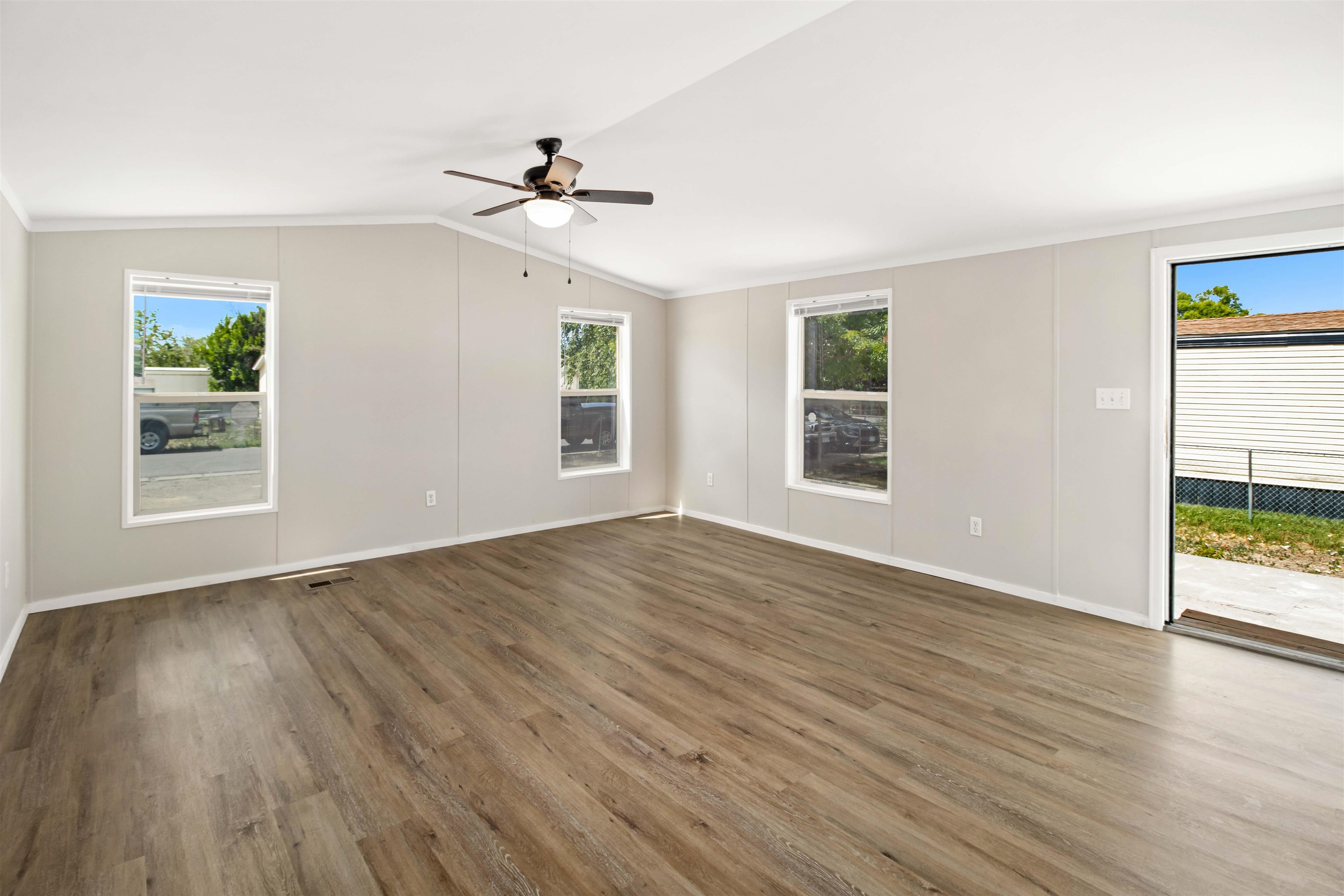 424 32 Road, Unit 85 Clifton, CO 81520 - Photo 3 of 12 a view of an empty room with wooden floor and a window