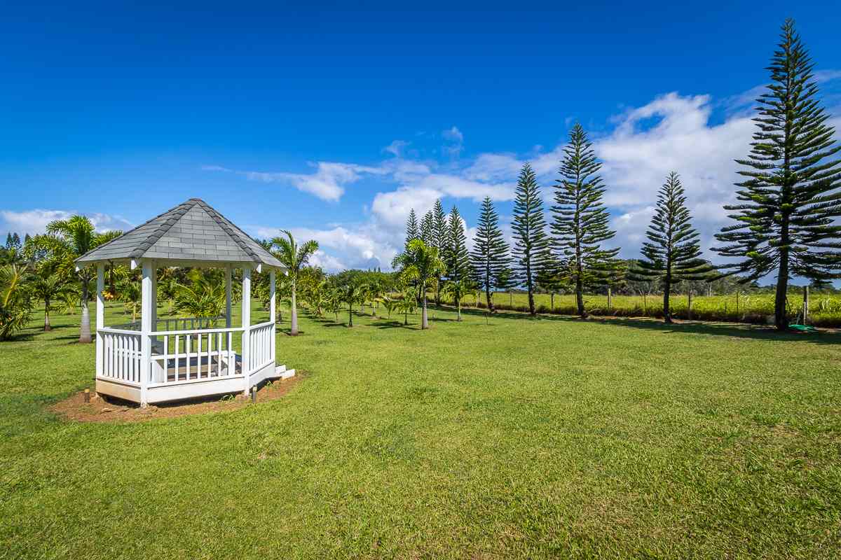 1320 West Kuiaha Road Haiku, HI 96708 - Photo 4 of 29 a front view of a house with garden