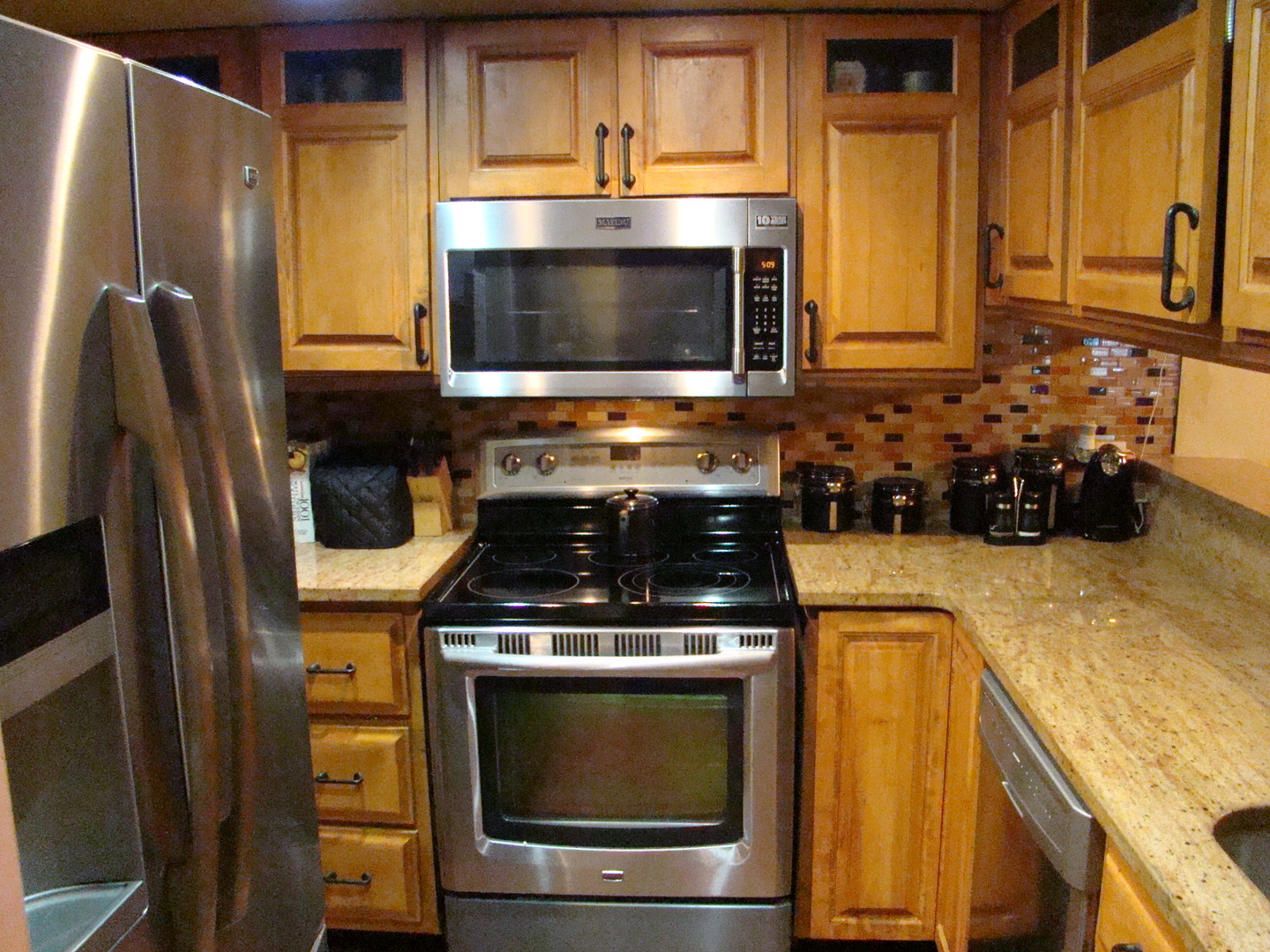 830 Elder Road, Unit B202 Homewood, IL 60430 - Photo 11 of 32 a kitchen with stainless steel appliances a stove a microwave and a sink