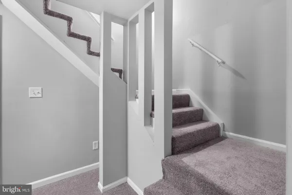 a view of a hallway with staircase