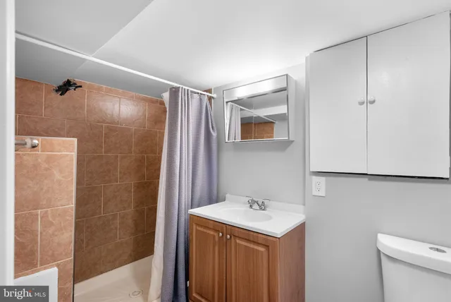a bathroom with a sink and mirror