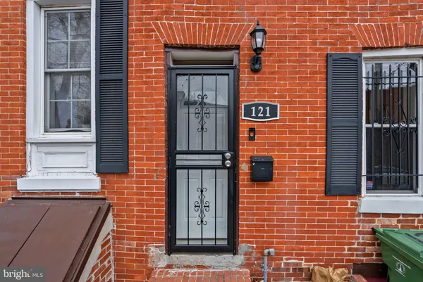a brick building with a window and door