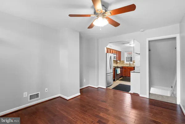 a view of a livingroom with a kitchen