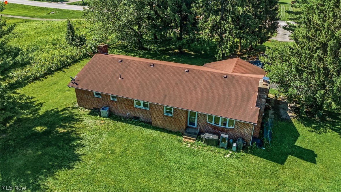 6890 Refugee Road Pickerington, OH 43147 - Photo 35 of 49 Brick exterior with a red shingle roof