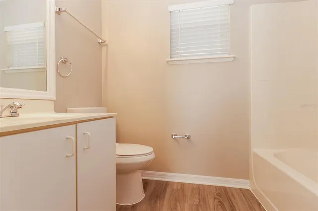 a bathroom with a sink a toilet and a bathtub