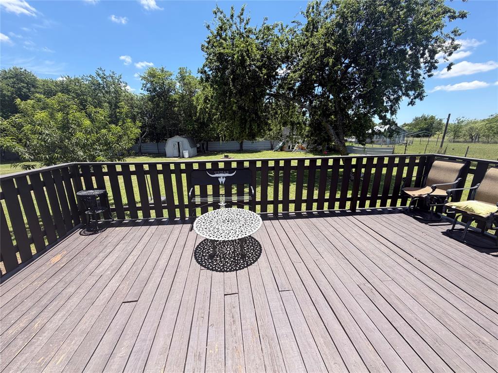 222 Hix Road Cleburne, TX 76031 - Photo 21 of 27 a balcony with wooden floor