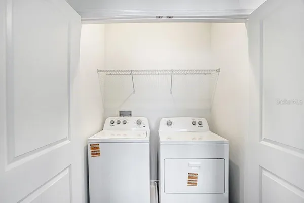 a utility room with dryer and washer
