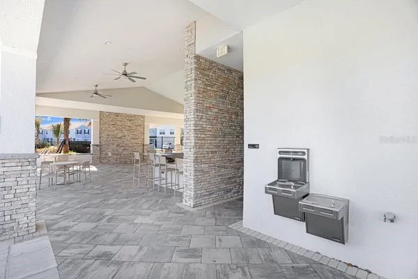 a view of a hallway with seating area