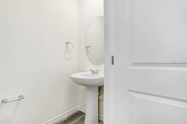 a bathroom with a sink and mirror