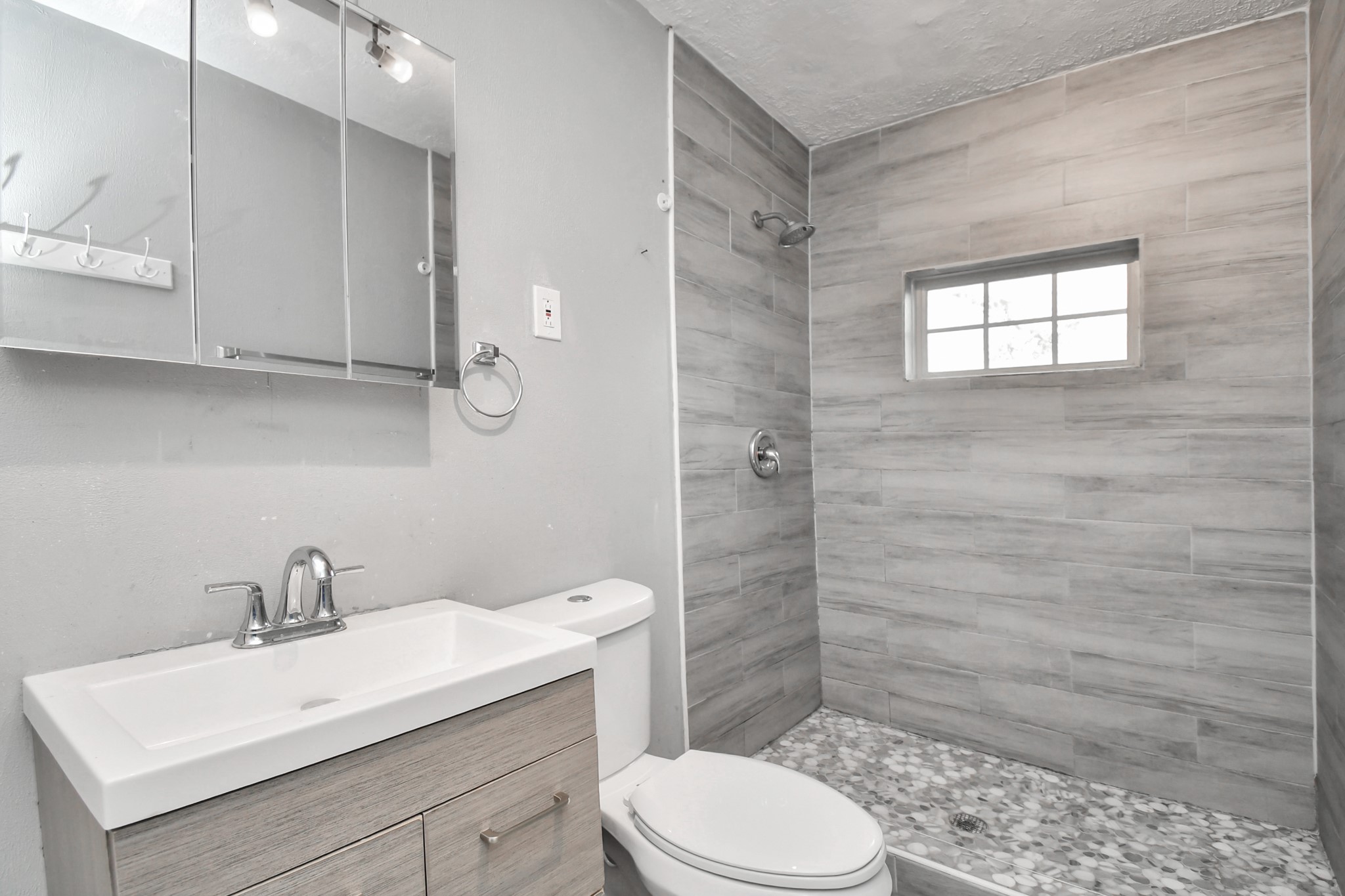 1008 Vista Road Pasadena, TX 77504 - Photo 16 of 50 a bathroom with a sink a toilet and shower