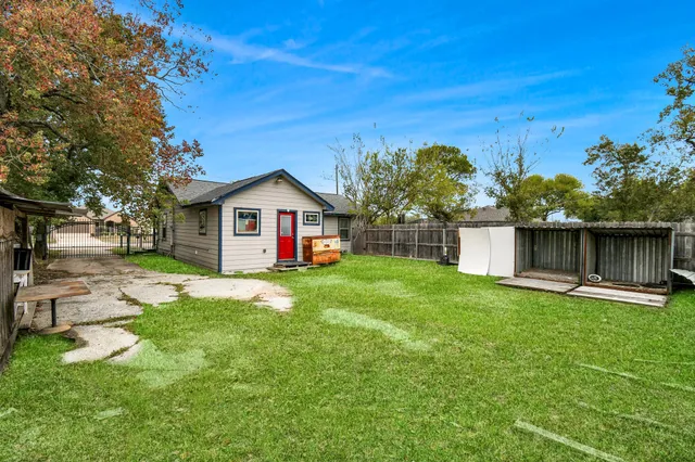 a front view of a house with yard and green space