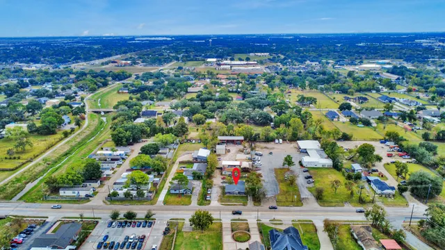 an aerial view of residential houses with outdoor space
