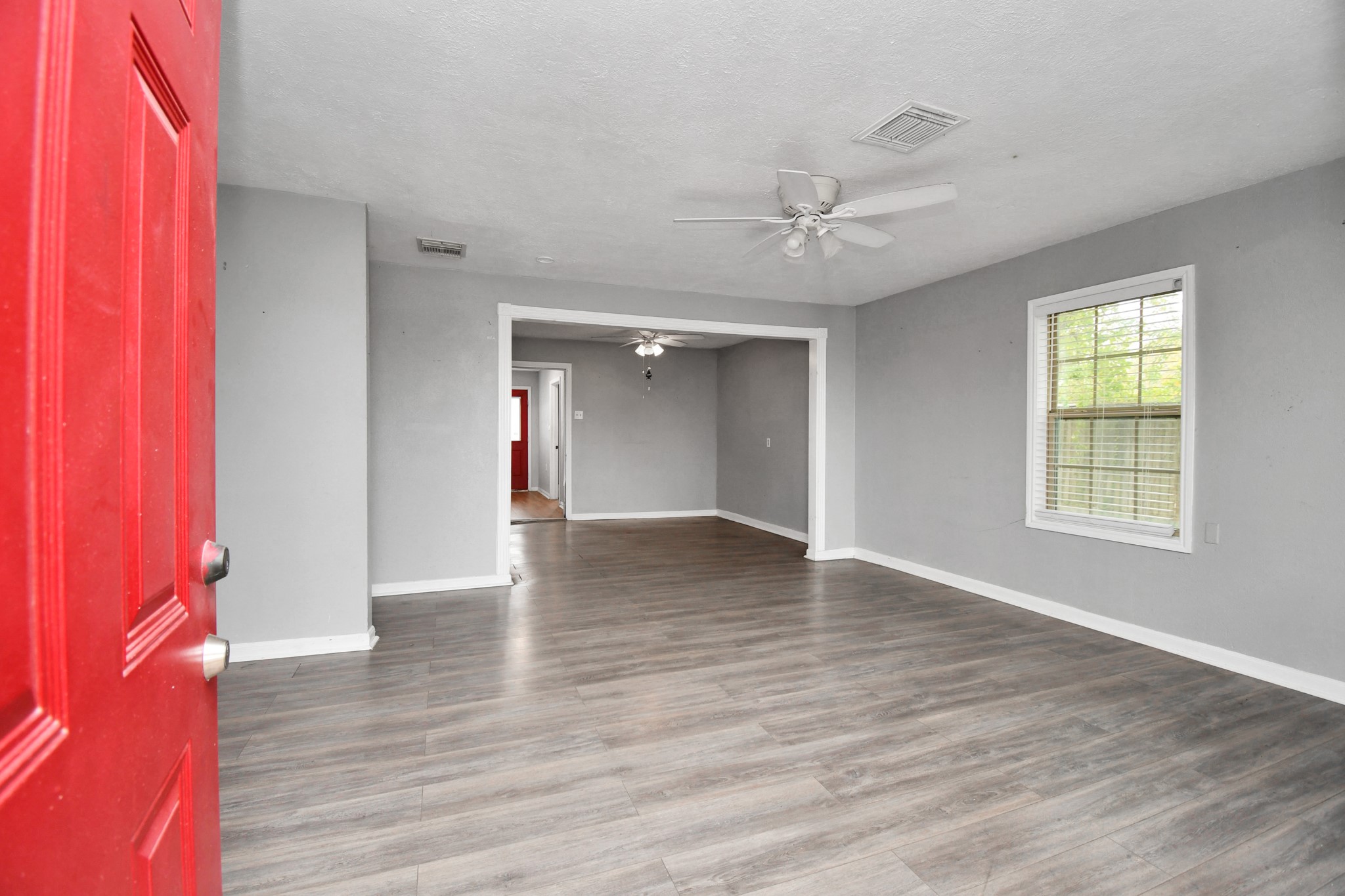 1008 Vista Road Pasadena, TX 77504 - Photo 6 of 50 wooden floor in an empty room with a window