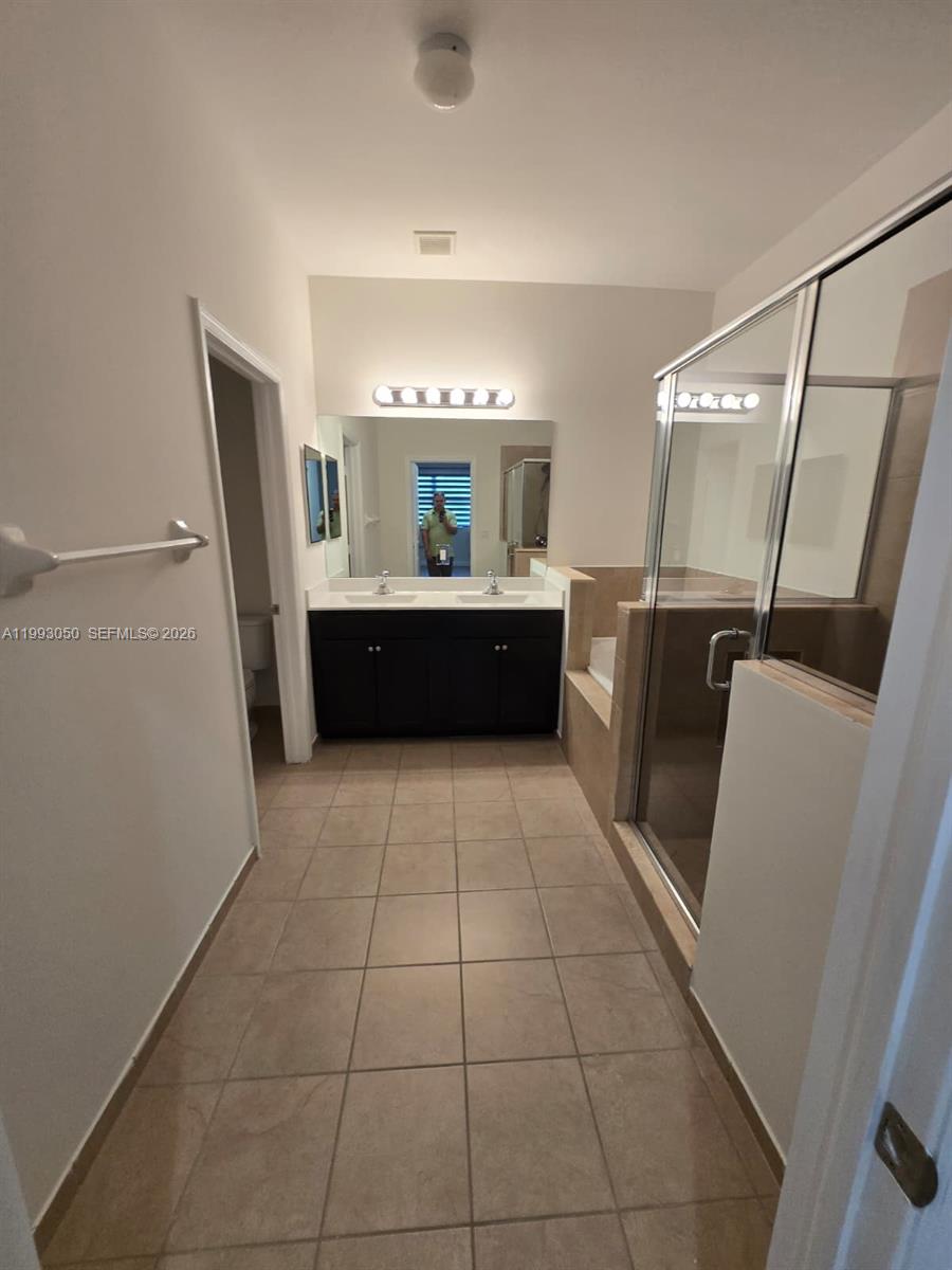4268 Southwest 166th Court, Unit 4268 Miami, FL 33185 - Photo 11 of 21 a large kitchen with a sink a refrigerator and dishwasher