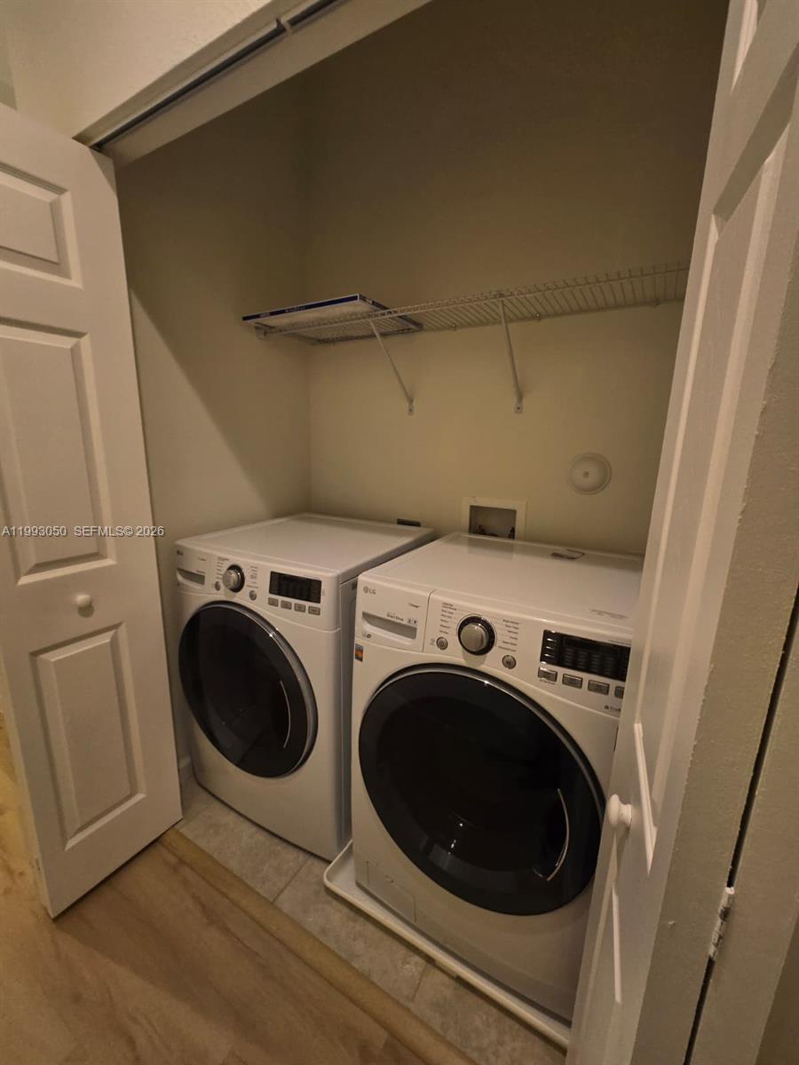 4268 Southwest 166th Court, Unit 4268 Miami, FL 33185 - Photo 18 of 21 a utility room with dryer and washer
