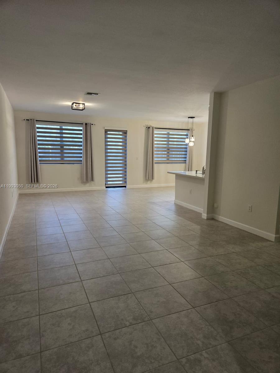 4268 Southwest 166th Court, Unit 4268 Miami, FL 33185 - Photo 2 of 21 a view of an empty room with a window