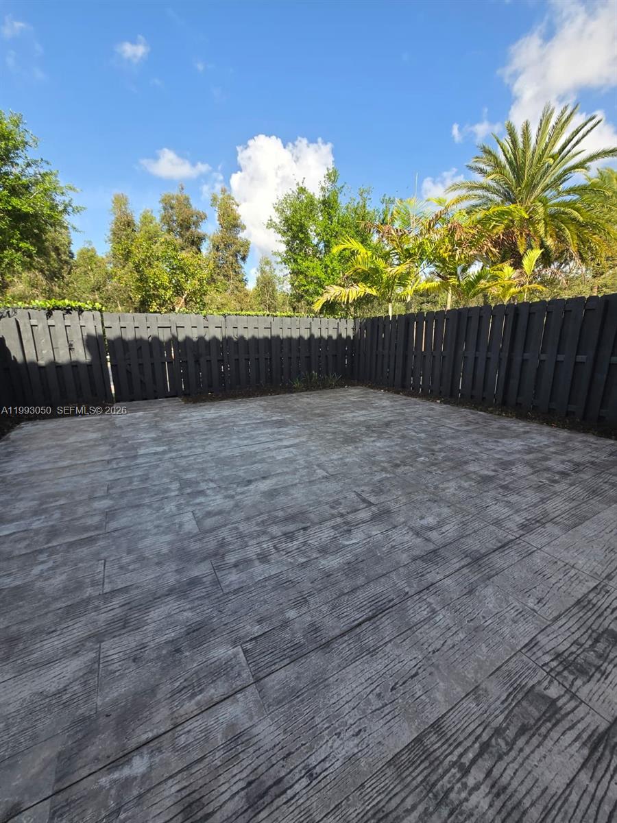4268 Southwest 166th Court, Unit 4268 Miami, FL 33185 - Photo 21 of 21 a view of garden with wooden fence