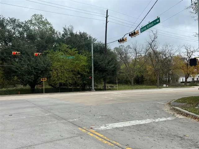 a view of a city street with a building