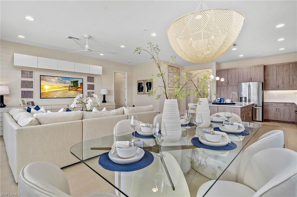 12777 Springbrook Court Estero, FL 33928 - Photo 5 of 27 a living room with furniture and a large window