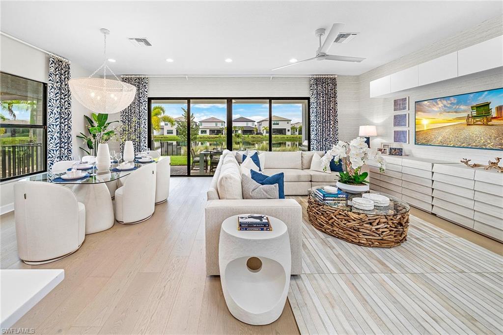 12777 Springbrook Court Estero, FL 33928 - Photo 6 of 27 a living room with furniture and a large window