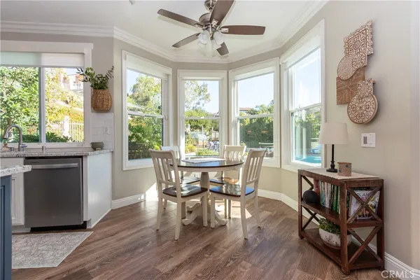 a kitchen with kitchen island granite countertop a sink appliances and cabinets