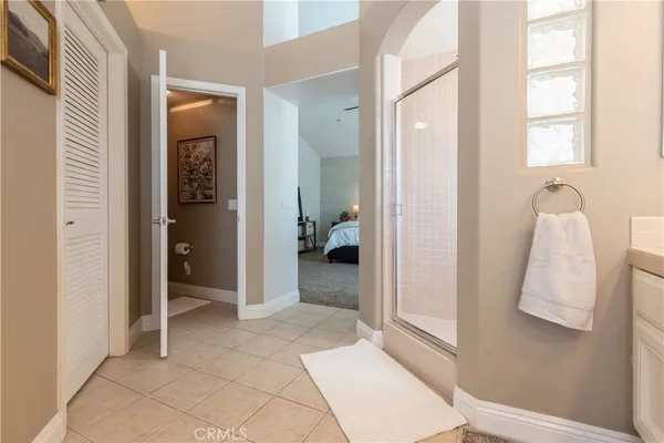 a bathroom with a double vanity sink a mirror and a bathtub