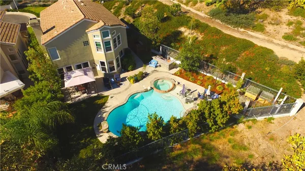 a view of swimming pool with a yard